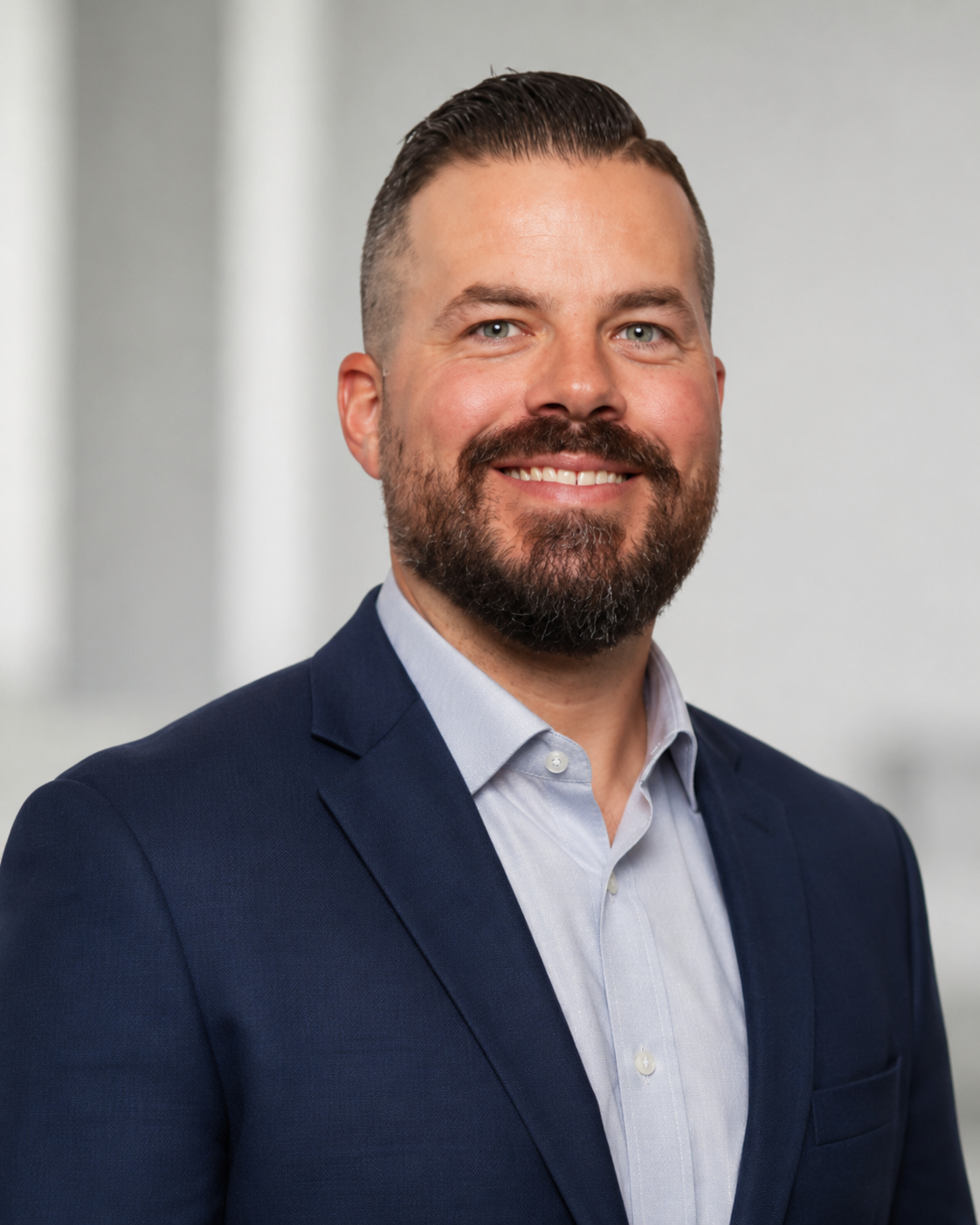 James Taverner, mortgage broker, wearing a navy suit and light blue shirt